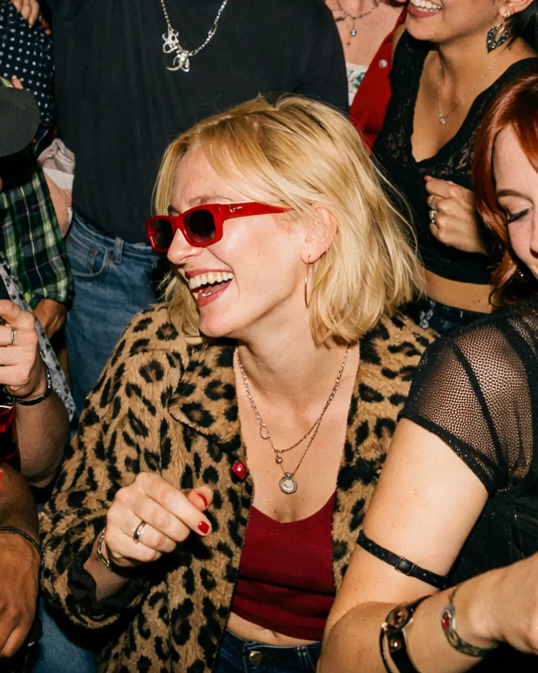 Laughing at a party with no drink in hand